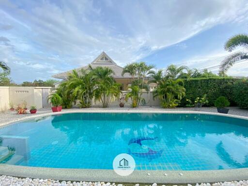 View of swimming pool with surrounding greenery in a residential property