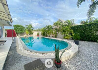 Beautiful pool area with surrounding greenery