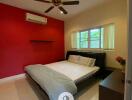 Spacious bedroom with a large window, air conditioner, and ceiling fan