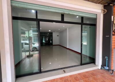 Modern storefront with large glass windows and tiled flooring