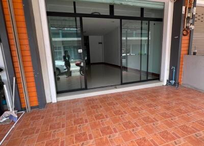 Front view of a building with sliding glass doors and tiled flooring