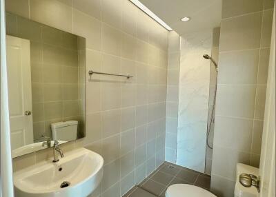 Modern bathroom with tiled walls and floor