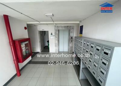 Apartment building hallway with mailboxes