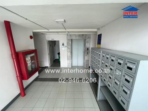 Apartment building hallway with mailboxes