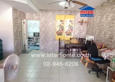 Spacious living room with dining area and staircase