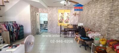 Spacious living room with dining area and staircase