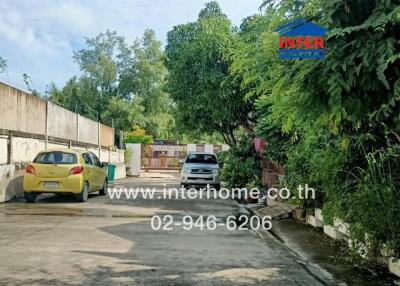 Driveway leading to the residential buildings.