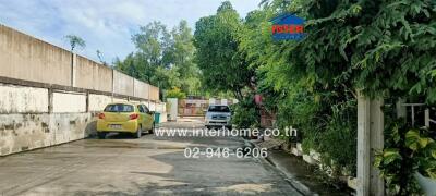 Driveway leading to the residential buildings.