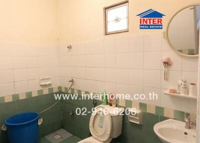 A clean and small bathroom with essential amenities