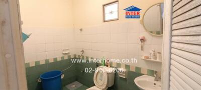 A clean and small bathroom with essential amenities