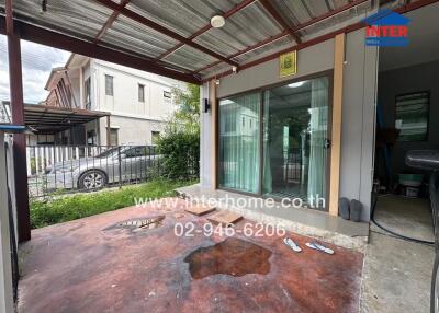 Covered outdoor patio with sliding glass doors