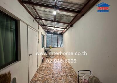 Utility room with tiled flooring and basic fixtures