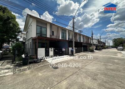 Modern townhouse complex with clear skies