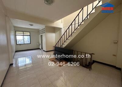 Spacious living area with staircase