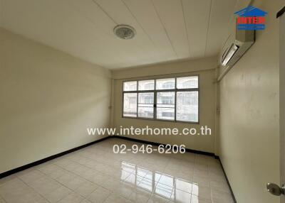 Unfurnished bedroom with large windows