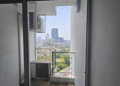 View of a balcony with a cityscape backdrop