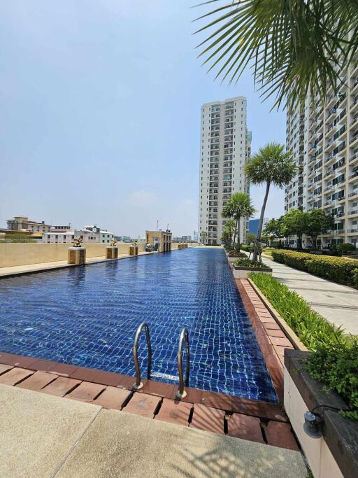 rooftop pool with view of cityscape