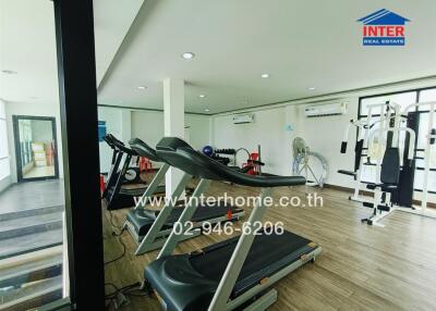 Fitness center with exercise equipment including treadmills and weight machines