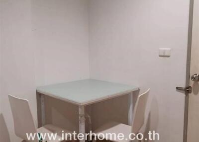 Small dining area with a table and two chairs