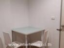 Small dining area with a table and two chairs