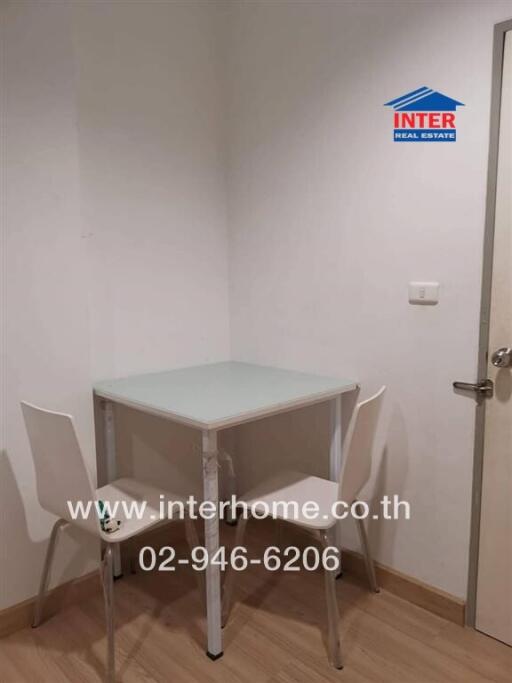 Small dining area with a table and two chairs