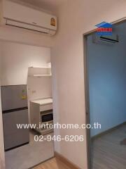 Small kitchen with air conditioning and modern appliances