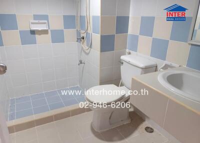 Bathroom with tiles and shower area