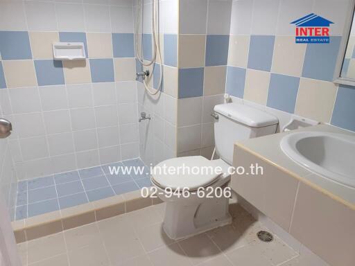 Bathroom with tiles and shower area