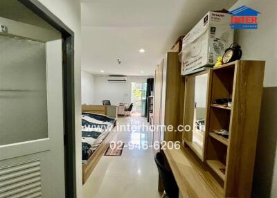 Modern bedroom with desk and storage units