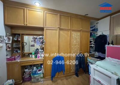 Bedroom with large wooden wardrobes