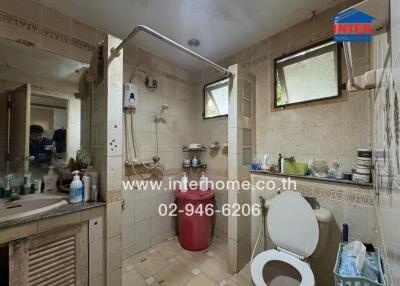 Bathroom with shower, toilet, and sink