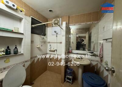 Bathroom with fixtures and storage