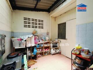 Small kitchen with appliances and shelves