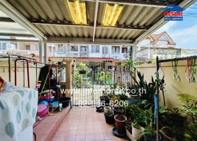 Outdoor area with plants and seating