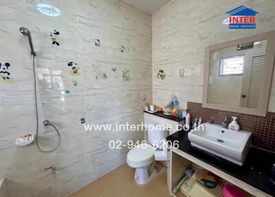 Bathroom with shower and sink