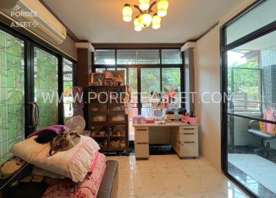 Modern living room with large windows and abundant natural light.