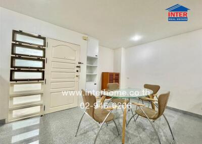 Dining area with modern chairs and glass table