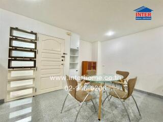 Dining area with modern chairs and glass table