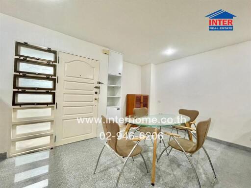 Dining area with modern chairs and glass table