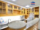 Modern kitchen with wooden cabinets and curved countertop