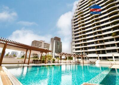 Swimming pool with surrounding buildings