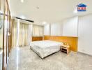 Spacious bedroom with large windows and ample natural light