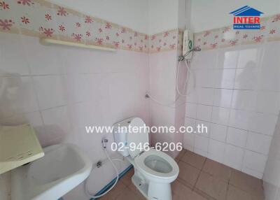 Bathroom with sink, toilet, and shower