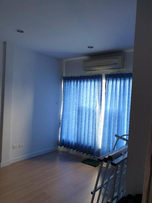 Living room with blue curtains