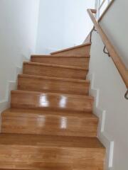 Wooden staircase with handrail