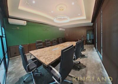 Modern meeting room with large table and chairs