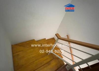 Wooden staircase with handrail