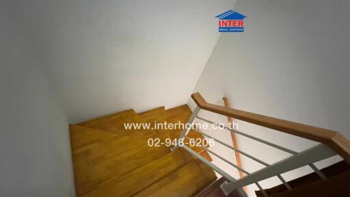 Wooden staircase with handrail