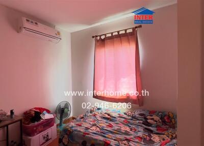 Bedroom with window and air conditioner