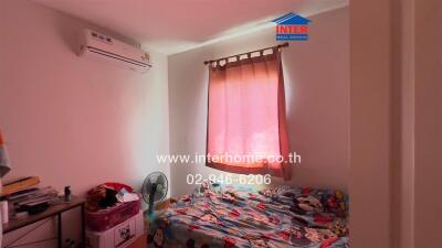 Bedroom with window and air conditioner